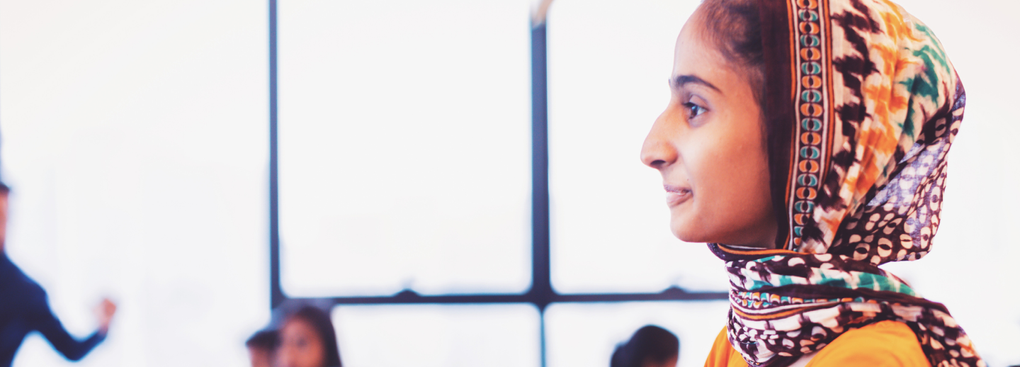 young woman with headdress 1440 x 518.png